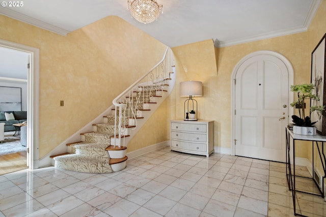 entryway featuring stairway, marble finish floor, baseboards, and ornamental molding