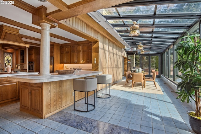 interior space with a lanai, outdoor dining area, and outdoor dry bar