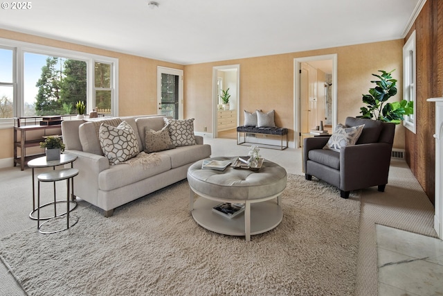 living area with carpet flooring, baseboards, and visible vents