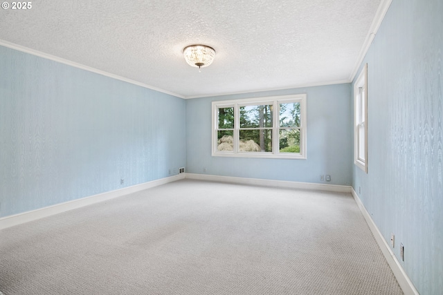 carpeted empty room featuring a textured ceiling, baseboards, and ornamental molding