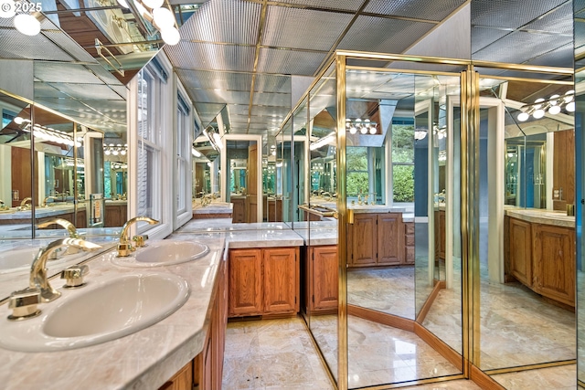 bathroom featuring a sink and double vanity