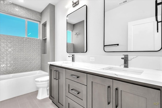 full bathroom featuring toilet, tile patterned flooring, vanity, and shower / bathing tub combination