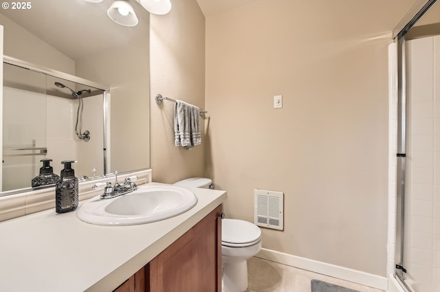 bathroom with tile patterned flooring, vanity, toilet, and an enclosed shower