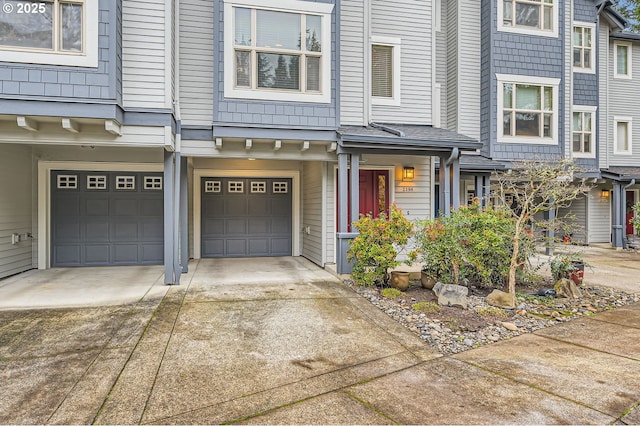 doorway to property with a garage