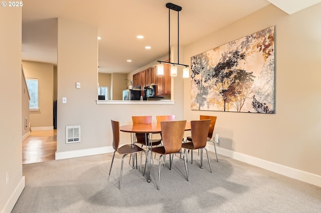 view of carpeted dining room