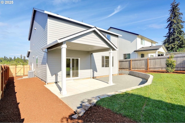 195 Iowa St, Silverton, OR 97381 - rear view of property featuring a yard, cooling unit, a fenced backyard, and a patio area