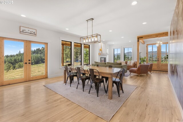 25053 Larson Rd, Monroe, OR 97456 - dining room with french doors, recessed lighting, a chandelier, and light wood-style floors