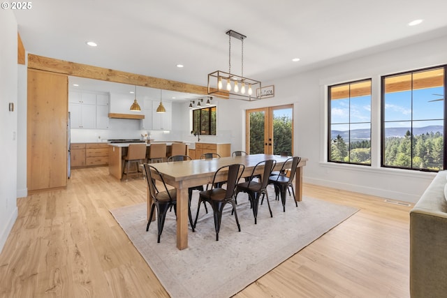 25053 Larson Rd, Monroe, OR 97456 - dining space with french doors, light wood finished floors, and recessed lighting