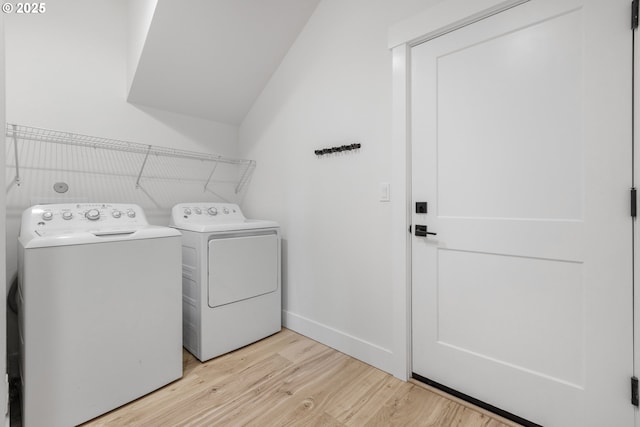 25053 Larson Rd, Monroe, OR 97456 - laundry room with washer and clothes dryer and light wood finished floors