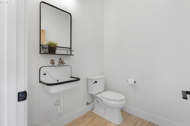 25053 Larson Rd, Monroe, OR 97456 - bathroom with toilet and wood finished floors