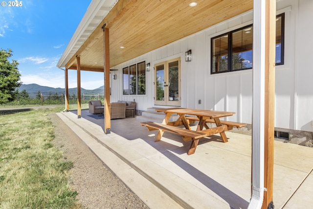 25053 Larson Rd, Monroe, OR 97456 - view of patio / terrace featuring a mountain view, french doors, and an outdoor hangout area