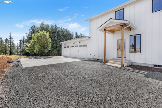 25053 Larson Rd, Monroe, OR 97456 - view of home's exterior featuring board and batten siding, crawl space, an attached garage, and driveway