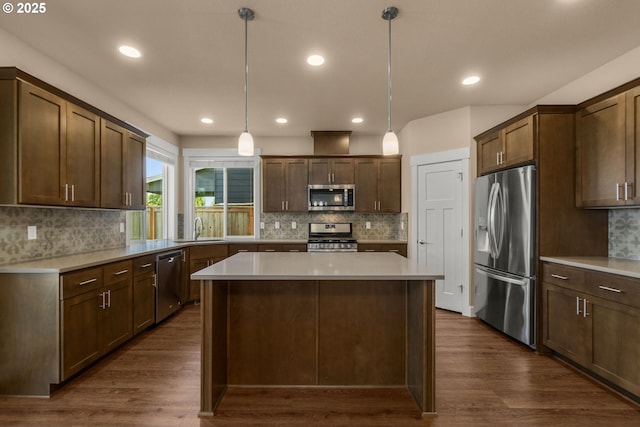 1803 35th Ave, Forest Grove, OR 97116 - kitchen with stainless steel appliances, a sink, tasteful backsplash, a kitchen island, and recessed lighting