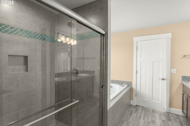 1803 35th Ave, Forest Grove, OR 97116 - bathroom with vanity, a garden tub, a shower stall, and wood finished floors