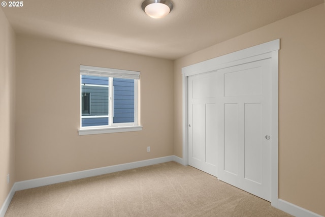 1803 35th Ave, Forest Grove, OR 97116 - unfurnished bedroom featuring carpet flooring, baseboards, and a closet