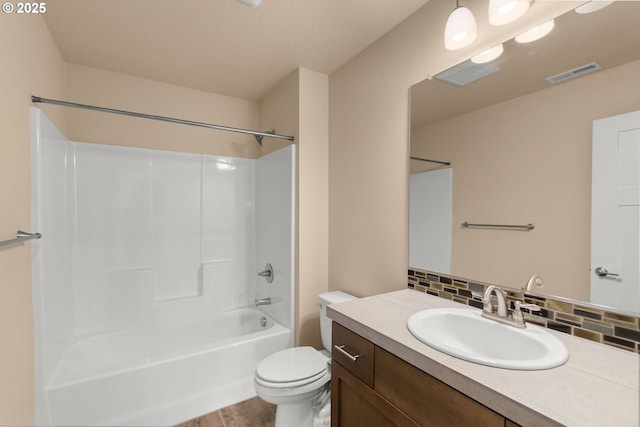 1803 35th Ave, Forest Grove, OR 97116 - bathroom with vanity, toilet, shower / tub combination, and decorative backsplash