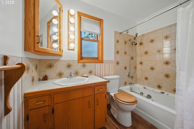 113 NE 7th Ave, Milton-Freewater, OR 97862 - full bath featuring toilet, shower / tub combo with curtain, vanity, wainscoting, and tile walls