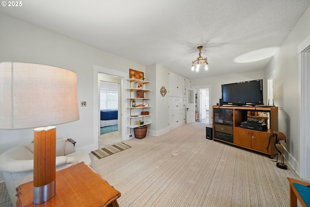 113 NE 7th Ave, Milton-Freewater, OR 97862 - living area with light carpet, a chandelier, and baseboards