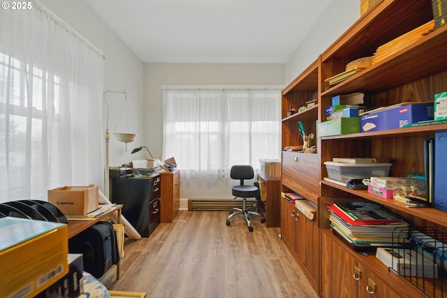 113 NE 7th Ave, Milton-Freewater, OR 97862 - home office with light wood-type flooring and a baseboard heating unit