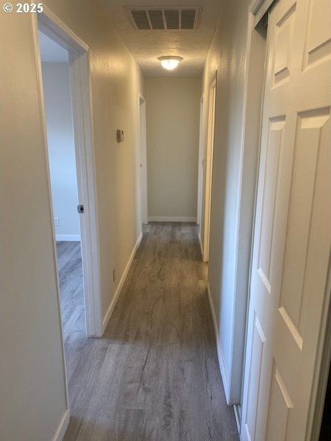 82277 Davisson Rd, Creswell, OR 97426 - hall featuring wood finished floors and baseboards