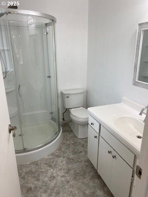 82277 Davisson Rd, Creswell, OR 97426 - bathroom featuring a stall shower, toilet, and vanity