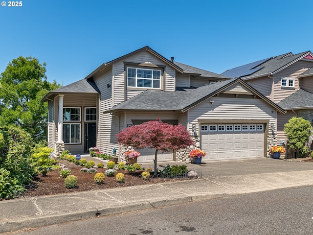 8833 SE Bristol Park Dr, Happy Valley, OR 97086 - view of front of home featuring driveway, roof with shingles, and a garage
