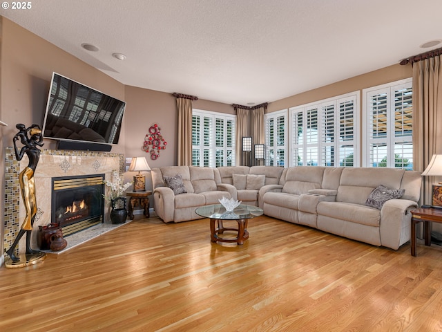 8833 SE Bristol Park Dr, Happy Valley, OR 97086 - living area featuring wood finished floors and a high end fireplace