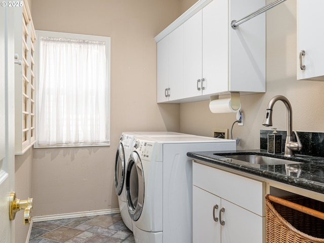 8833 SE Bristol Park Dr, Happy Valley, OR 97086 - washroom with washer and dryer, cabinet space, and stone finish floors