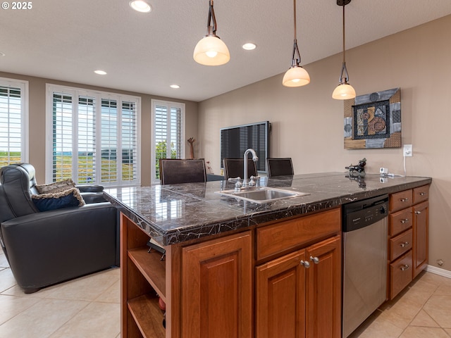 8833 SE Bristol Park Dr, Happy Valley, OR 97086 - kitchen featuring dishwasher, light tile patterned floors, open floor plan, brown cabinetry, and healthy amount of natural light