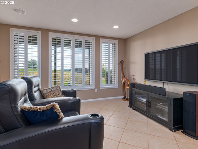 8833 SE Bristol Park Dr, Happy Valley, OR 97086 - living room featuring light tile patterned floors, recessed lighting, and a textured ceiling
