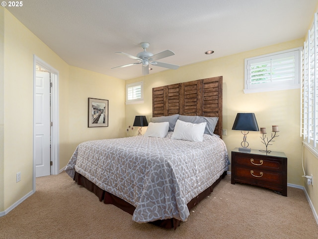 8833 SE Bristol Park Dr, Happy Valley, OR 97086 - bedroom featuring carpet, multiple windows, and a ceiling fan