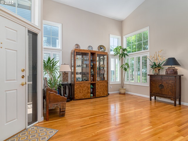 8833 SE Bristol Park Dr, Happy Valley, OR 97086 - foyer entrance featuring wood finished floors and high vaulted ceiling
