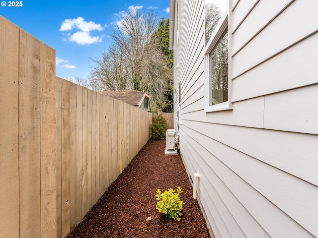 view of property exterior featuring fence private yard