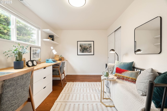 10258 N Allegheny Ave, Portland, OR 97203 - office area with dark wood-style floors, built in desk, and baseboards