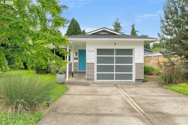 10258 N Allegheny Ave, Portland, OR 97203 - view of front of home with driveway and stone siding