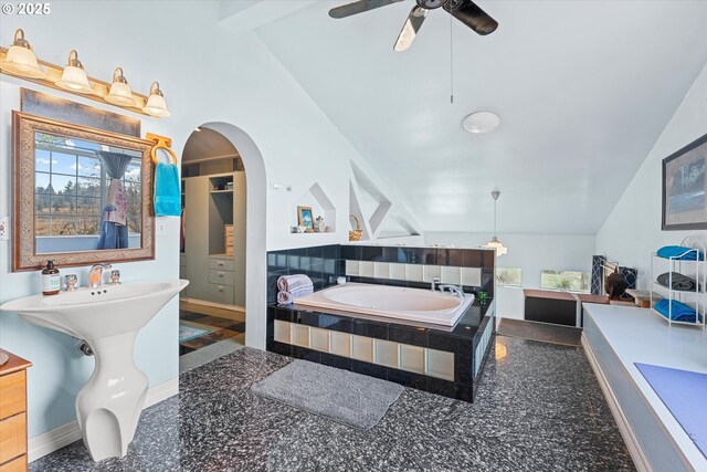 bedroom with lofted ceiling and sink