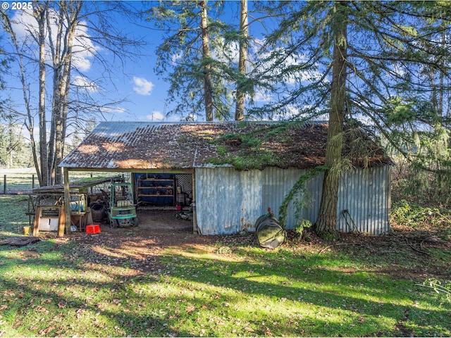 view of outbuilding featuring a lawn