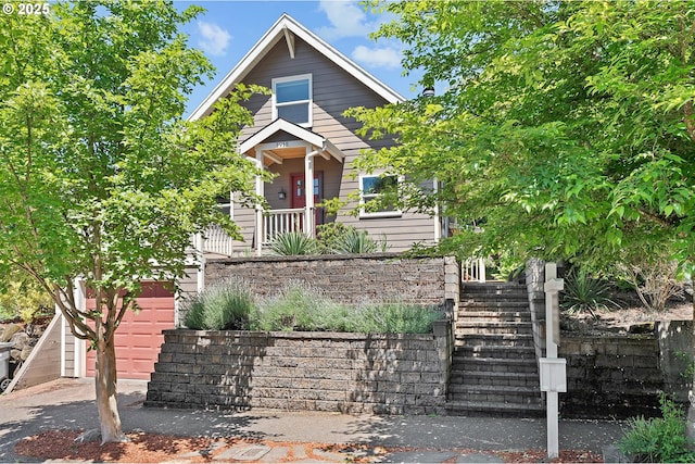 3915 SE Lambert St, Portland, OR 97202 - view of front of home featuring a garage and stairway