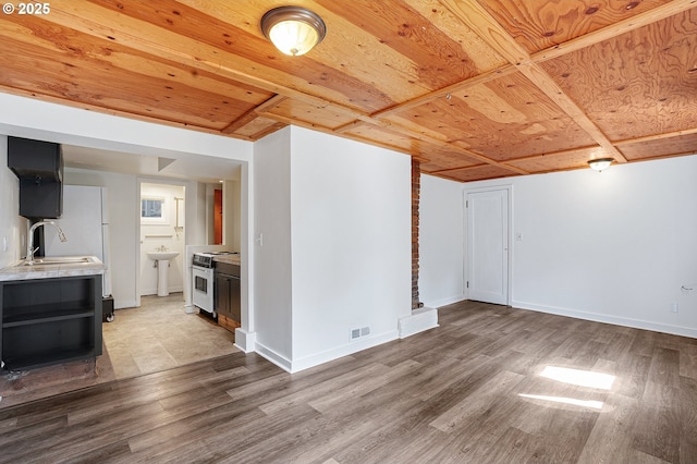 3915 SE Lambert St, Portland, OR 97202 - unfurnished living room featuring wood finished floors, a sink, wooden ceiling, and baseboards