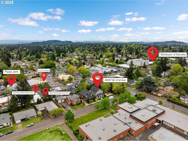 birds eye view of property with a mountain view