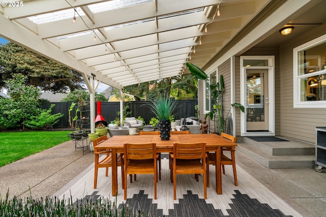 view of patio / terrace with a fenced backyard, outdoor dining space, and a pergola