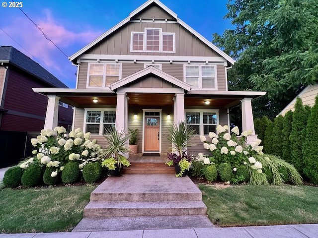 craftsman inspired home featuring board and batten siding and a porch