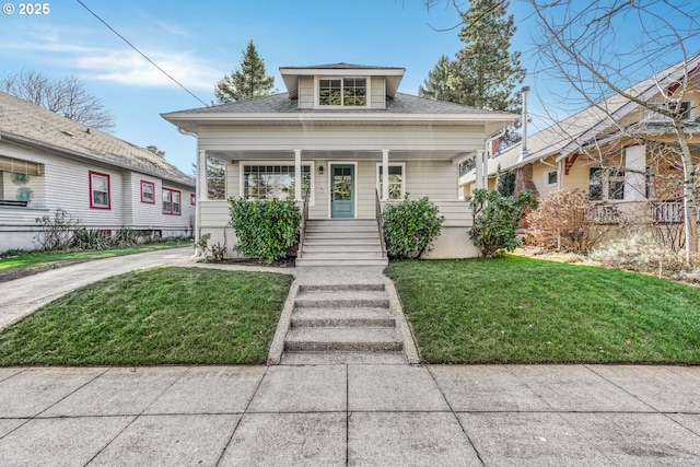 bungalow-style house featuring a porch and a front lawn