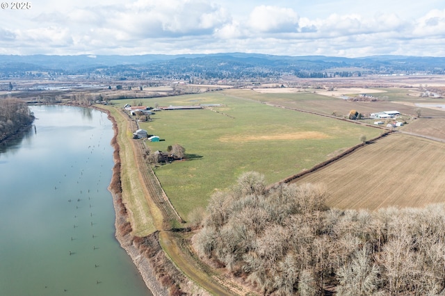 bird's eye view featuring a rural view and a water and mountain view