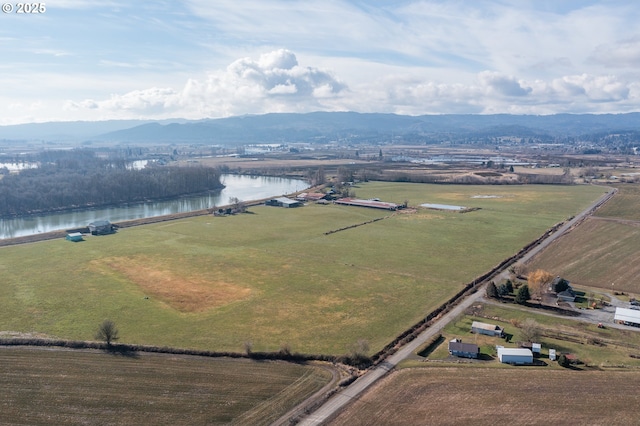 aerial view featuring a rural view and a water and mountain view