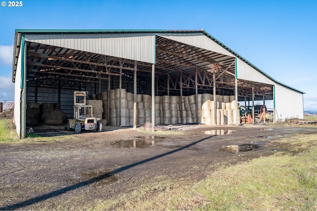 view of outdoor structure featuring an outbuilding and a detached carport