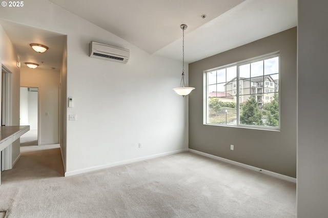 empty room featuring a wall mounted AC, light carpet, vaulted ceiling, and baseboards