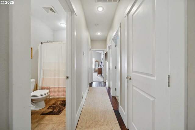 corridor with recessed lighting and visible vents