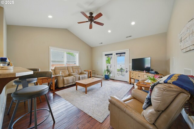living area with a ceiling fan, recessed lighting, wood finished floors, lofted ceiling, and visible vents