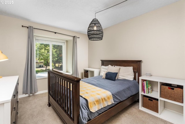 885 NW Torrey View Ln, Portland, OR 97229 - bedroom featuring light carpet, baseboards, and a textured ceiling